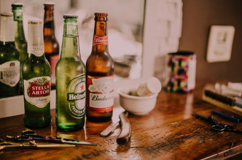 Bottles of alcohol: Budweiser, Stella Artois, etc.