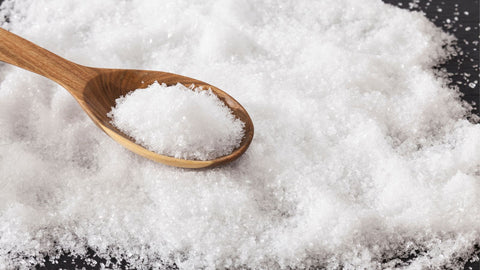magnesium chloride powder in a wooden spoon