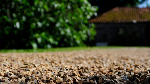 Tan pea gravel path in yard