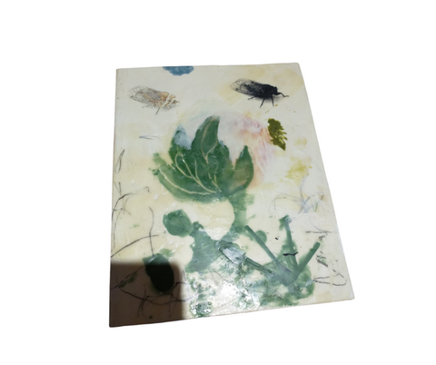 Encaustic artwork featuring a floral pattern with flies.