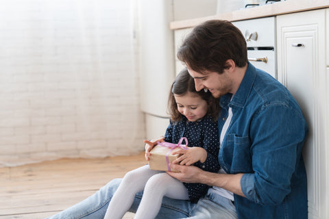 father and daughter celebrating father's day at home