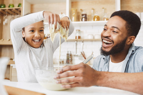 parent and child baking together - kids new years resolutions