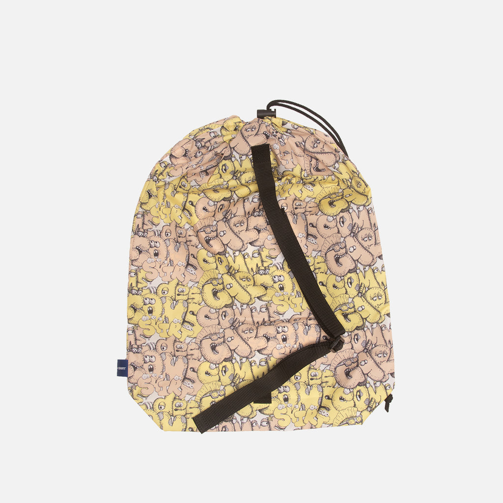 KAWS X CDG SHIRT PATTERN PRINT BAG - YELLOW | lapstoneandhammer.com