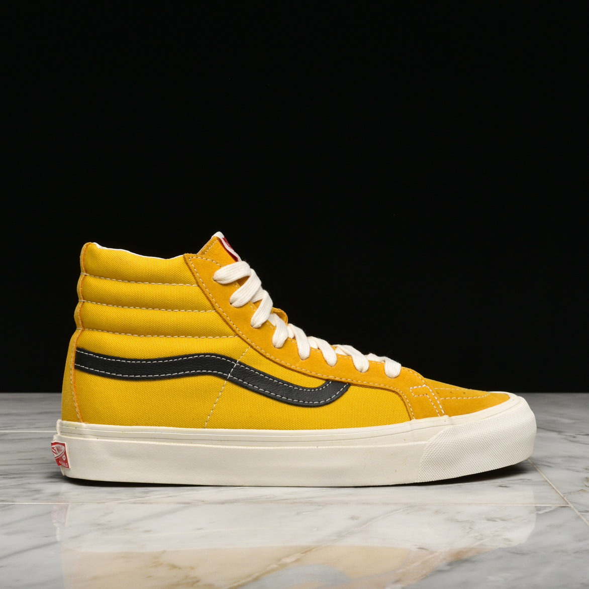 yellow and white high top vans