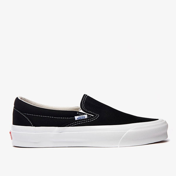 slip on white and black vans