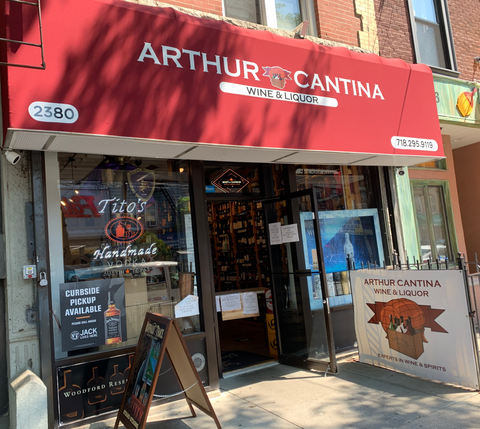 store on arthur avenue with a burgundy awning