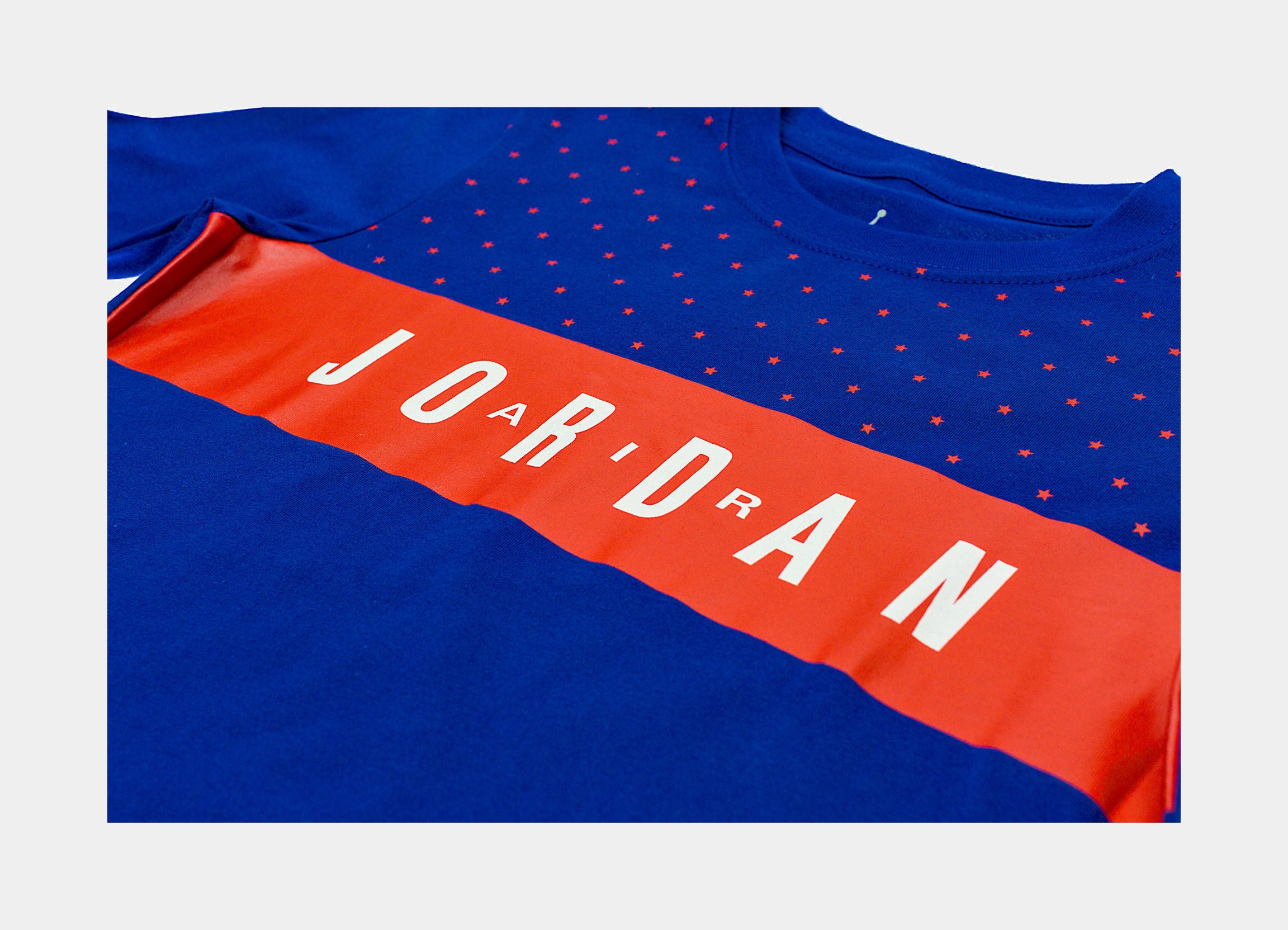 orange and blue jordan shirt