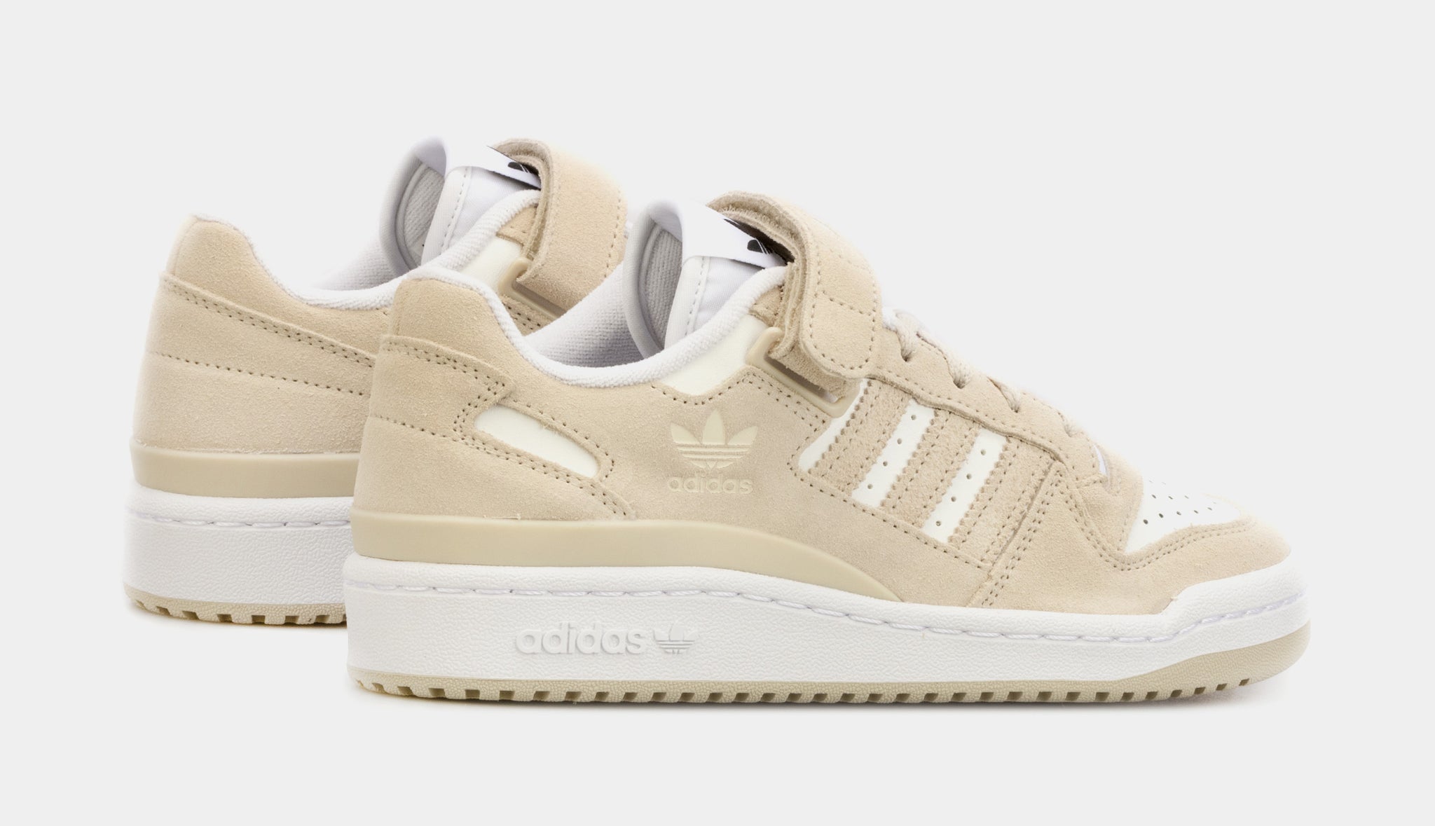 beige and white adidas