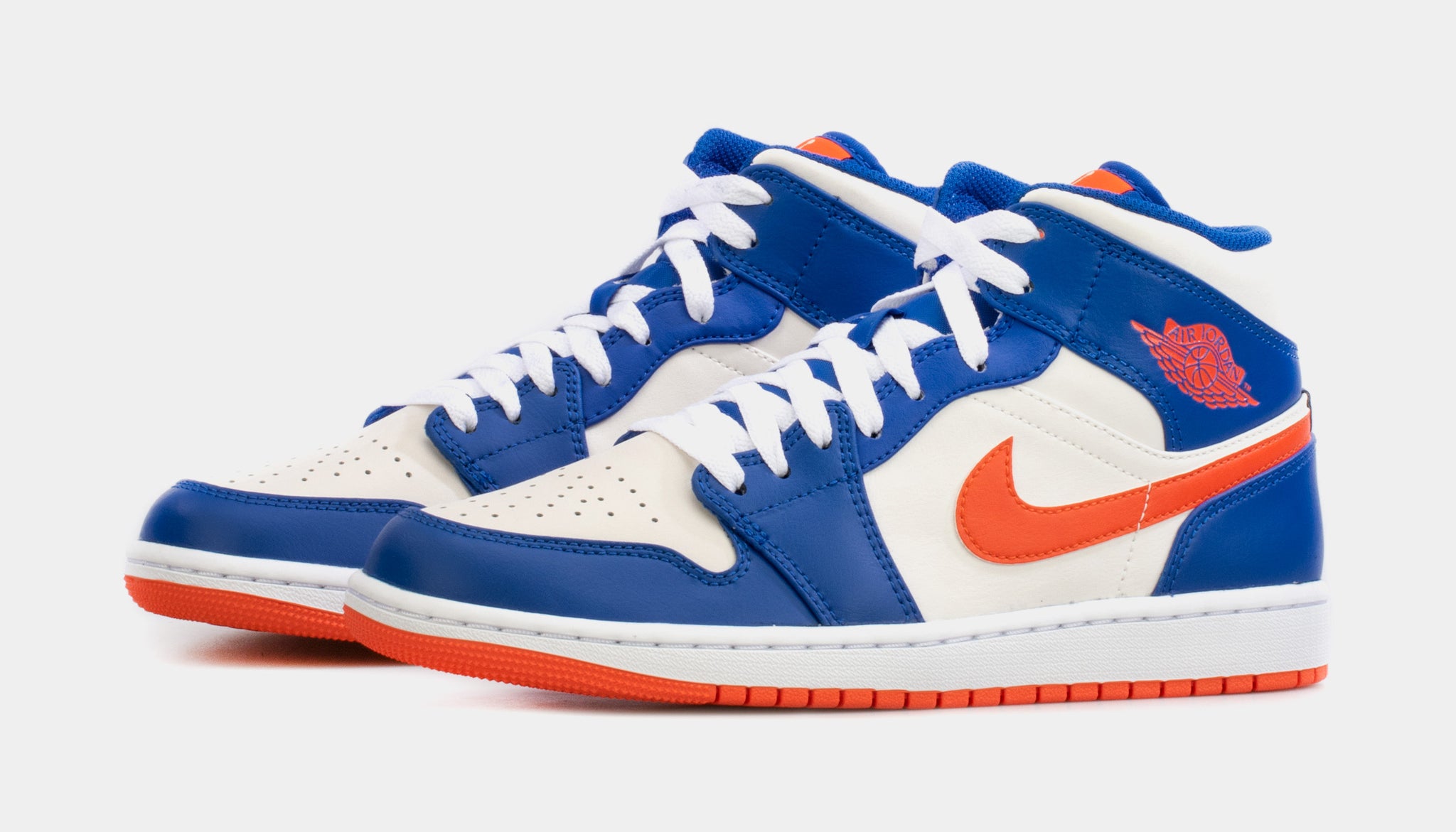 blue and white jordans with orange laces