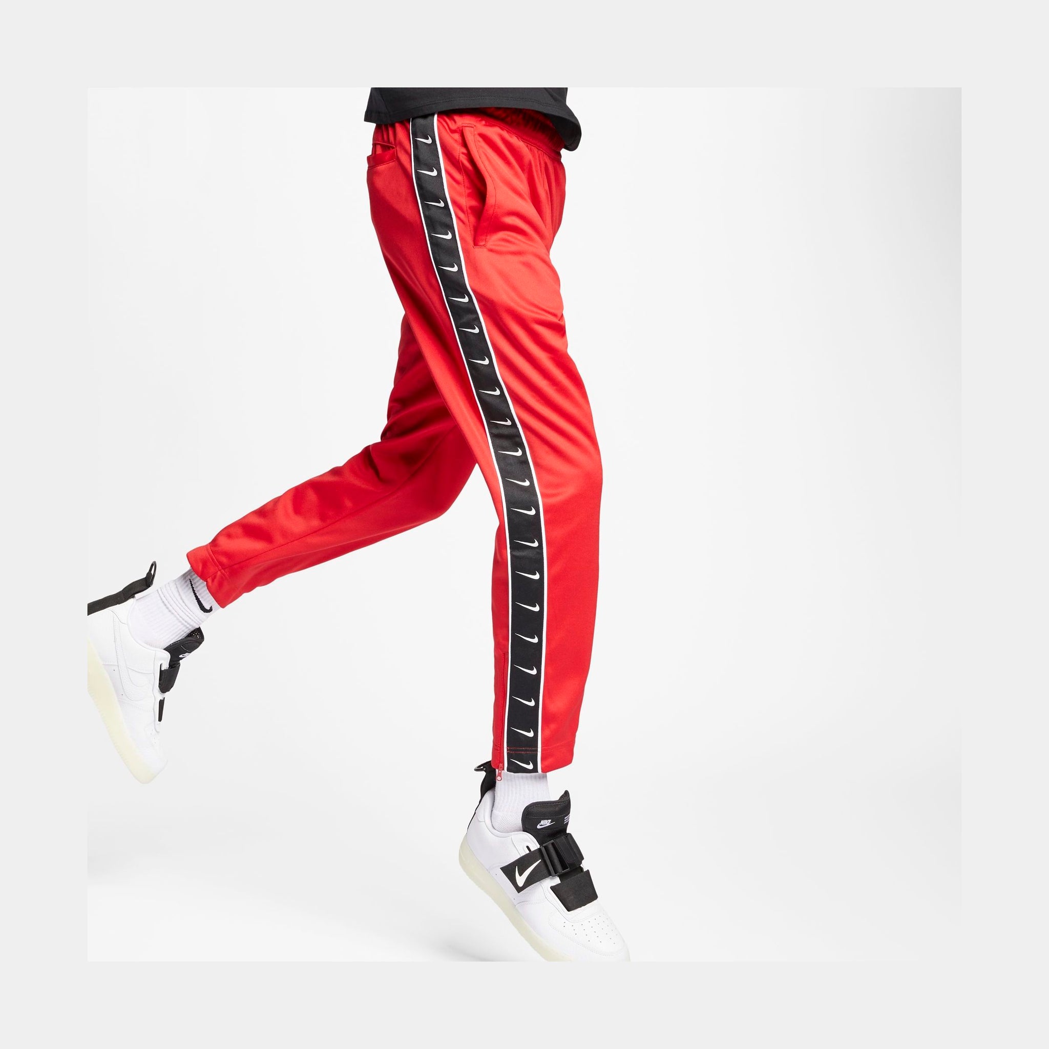 red nike sportswear pants