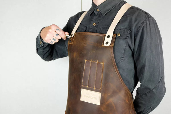tattoo artist wear a leather apron