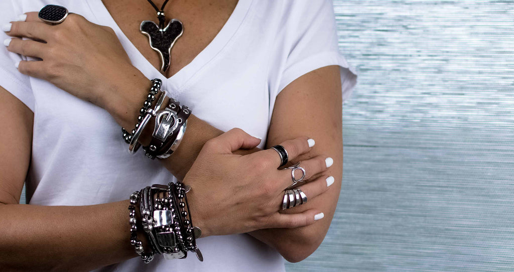 Stack of leather and metal bracelets