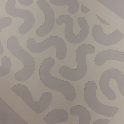 Smoothing down adhesive stencil