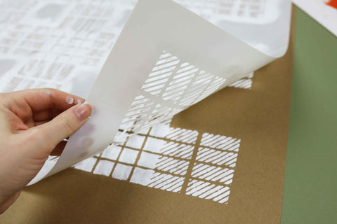 Removing a stencil from DIY kraft wrapping paper