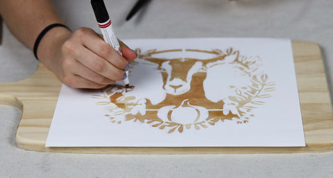 Color in the stencil with a wood burning marker