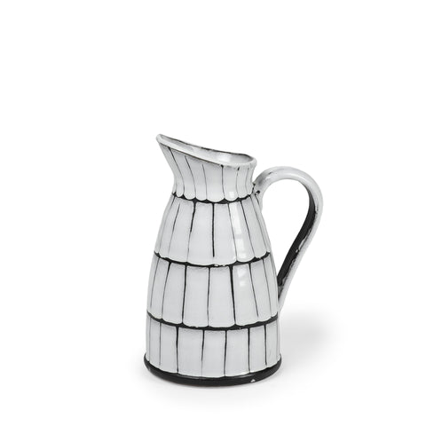 Artisanal 10-inch White and Black Ceramic Pitcher with creamy white glaze and dark clay edges, blending modern design with craftsmanship.