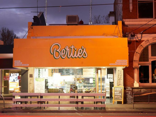 Berties Butcher shop front. Photo taken at night time.