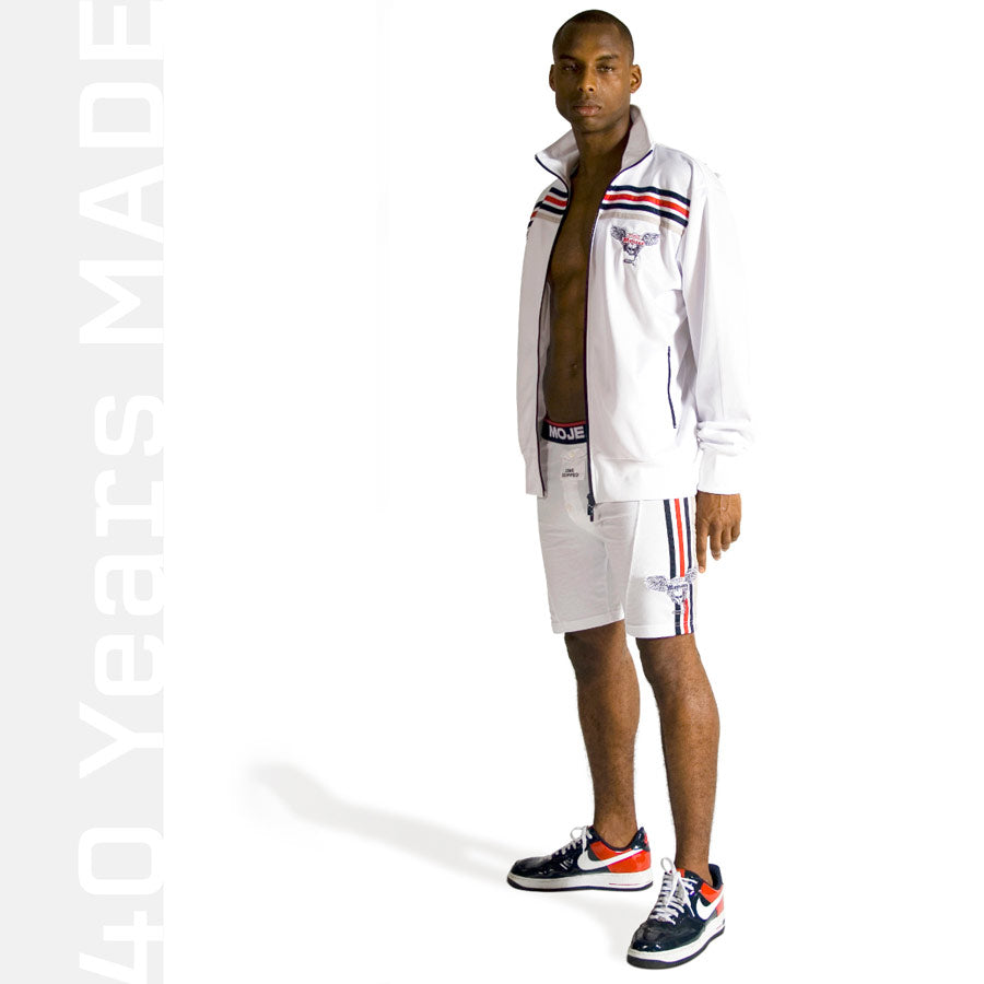 A male model wearing Mojeans Black Label white condom pocket underwear and track jacket styles from the early 2000s by African-American fashion designer Maurice Malone