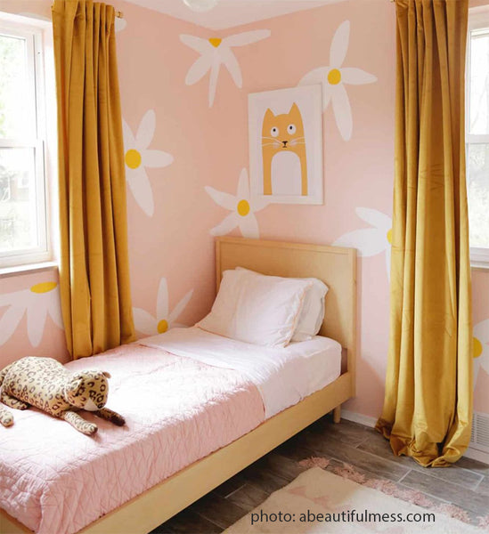 Large painted flower mural on bedroom walls