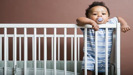 baby-boy-standing-up-in-crib