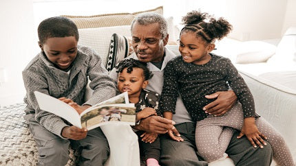 family-looking-at-christmas-photo-album