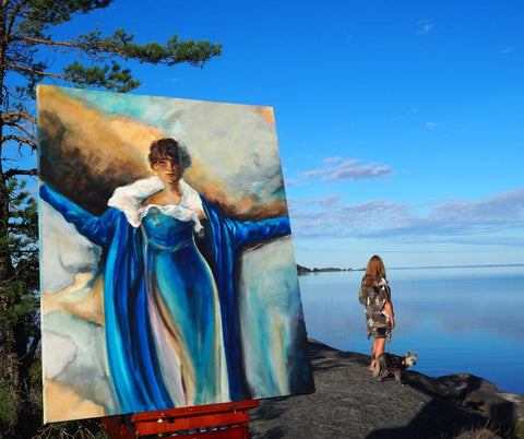 Artist Ingela Johansson with painting in summer studio Sweden