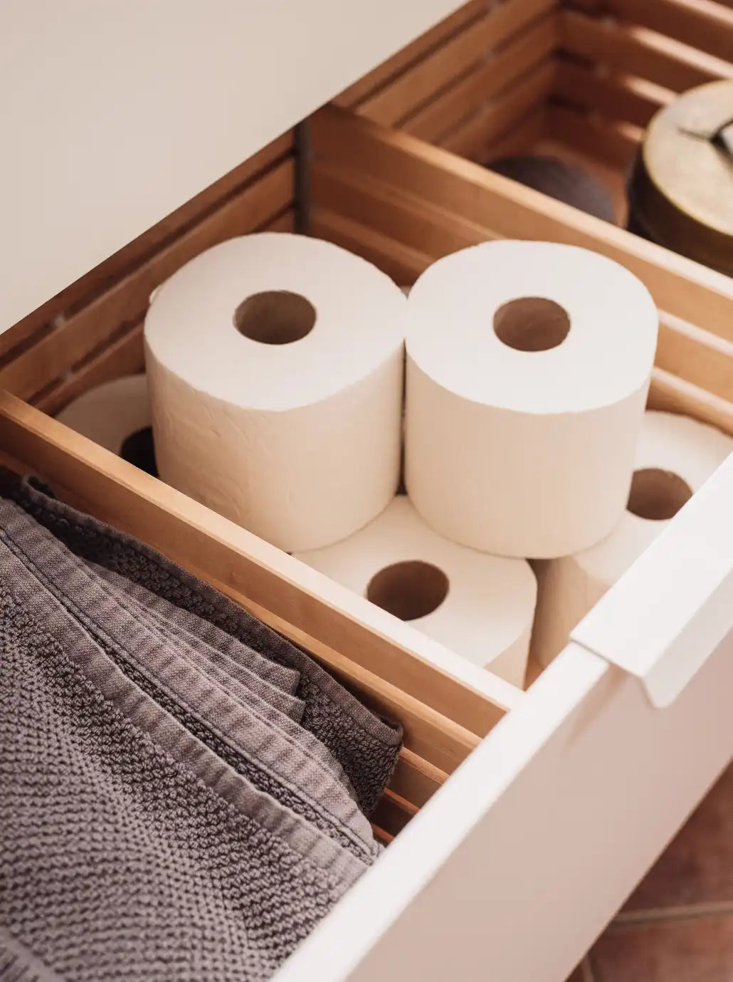 Bathroom supplies are neatly visited in vanity's drawer. | ACE DECOR