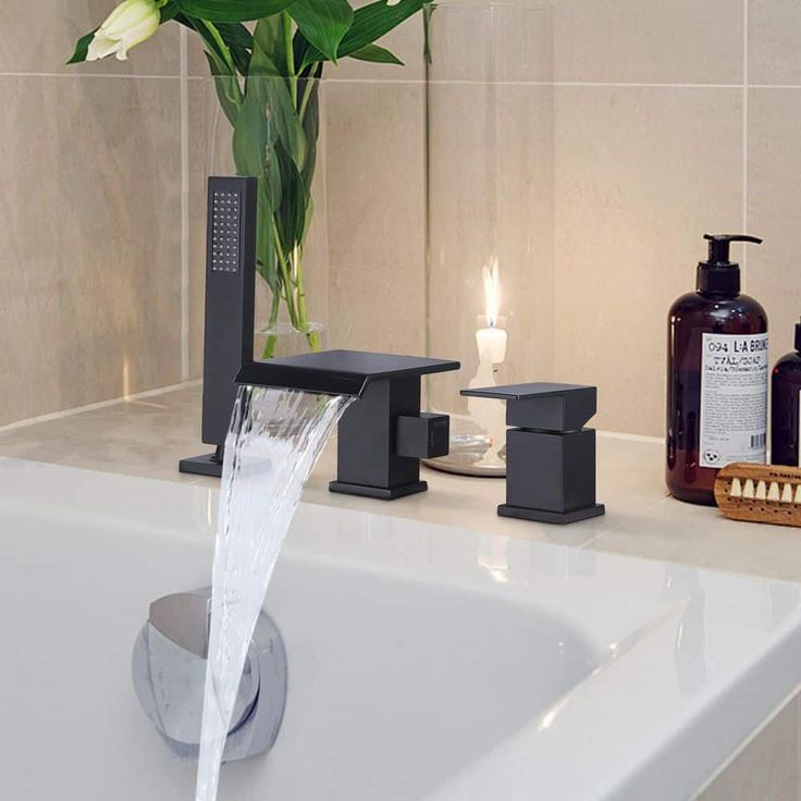 Matte black bathtub faucet with open stream, ideal for bathtub faucet aerator upgrade