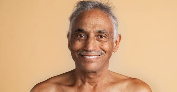 Wrinkles caused by smiling on old Indian man