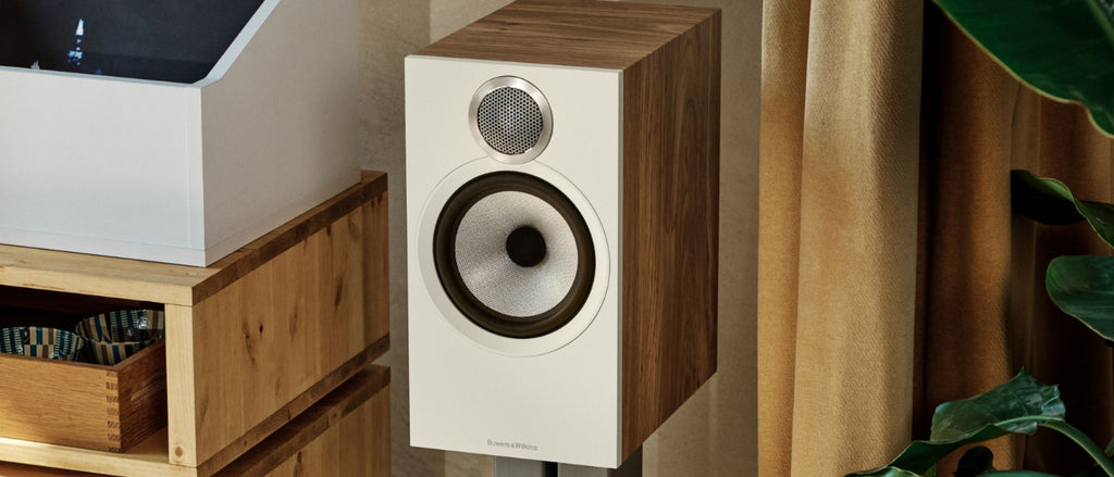 Modern looking Walnut Wood speaker with white face and silver driver