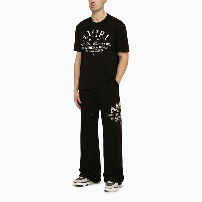 Shop Amiri Black Cotton Jogging Trousers For Men With Side Logo Print And Leather Label