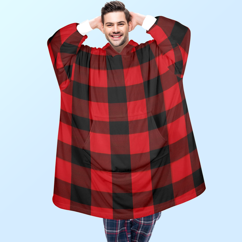 A man wearing a red flannel blanket hoodie made of fleece