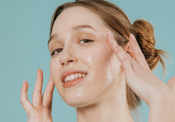 Woman applying enzymatic scrub