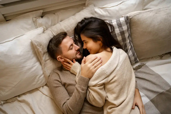 Men and women in bed