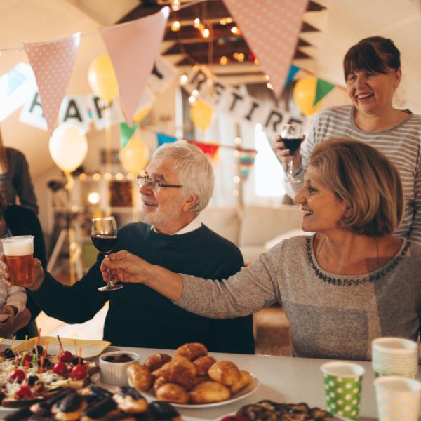 Joyful Retirement Party, with guests celebrating, gifts displayed, and decorations, embodying the spirit of retirement.