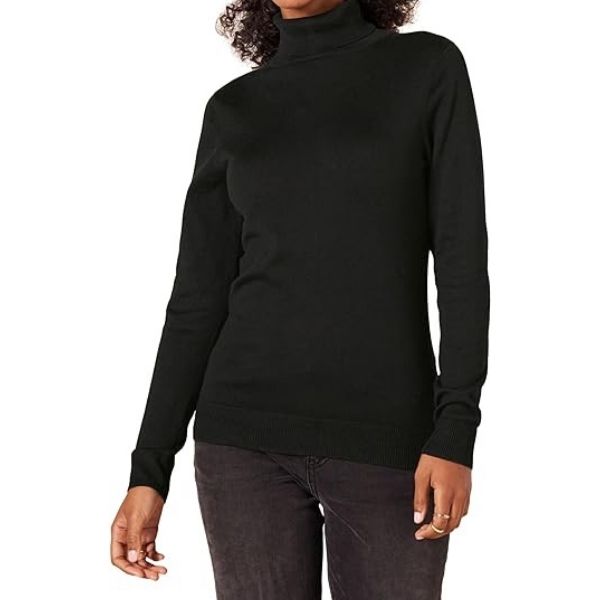 Woman wearing a sleek black Amazon Essentials turtleneck sweater, suitable for Grandparents Day gifting.