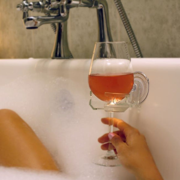 Innovative bathtub wine glass holder, a unique relaxation gift for single moms.