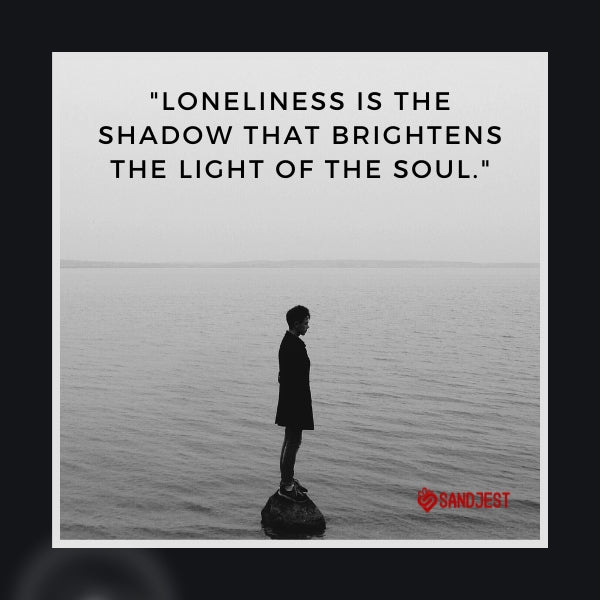Silhouette of a person standing on a rock in the sea, evoking the essence of loneliness quotes.