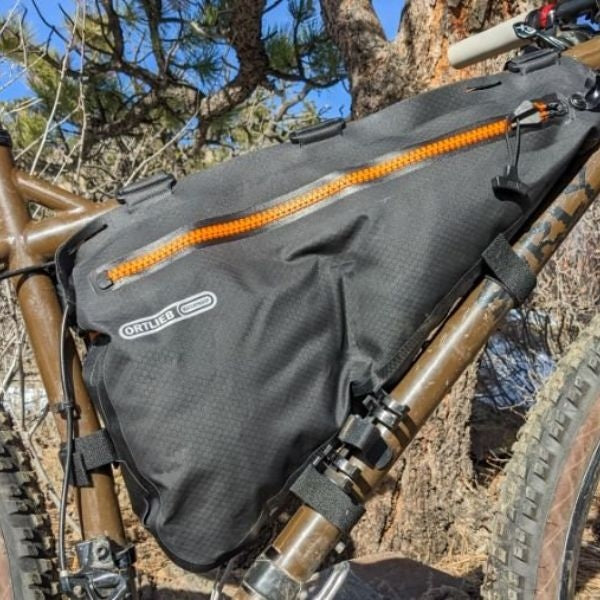 Sleek and sturdy bike frame bag, a practical gift for cycling enthusiasts, perfect for storing essentials on the go.