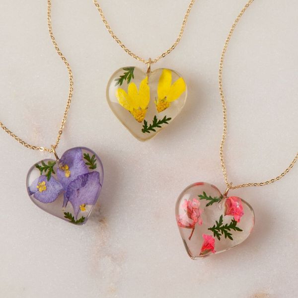 Tulianna and Alejandra Garces Birth Month Flower Heart Necklace, an elegant and personalized gift for older mom, featuring her birth month's flower.