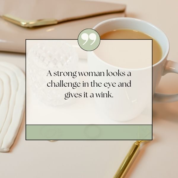 Empowering boss lady quote on facing challenges, with a cozy tea setting