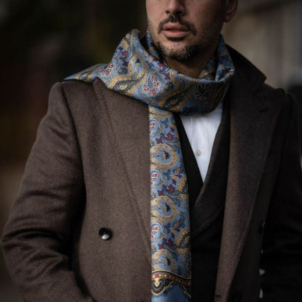 A designer scarf in various colors and patterns, a stylish gift for boyfriend's dad.