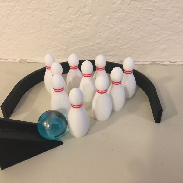 A miniature bowling set, the perfect gift for boyfriend's dad, allowing for fun and relaxation at home