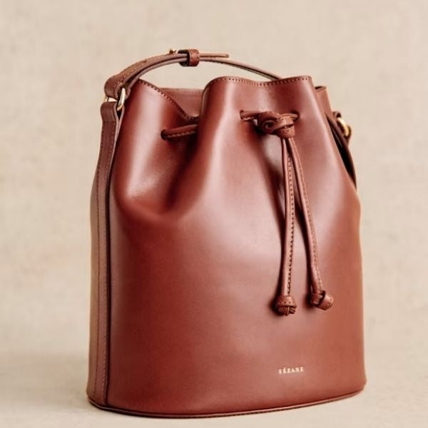 A fashionable bucket bag, chosen by a daughter as a Mother's Day gift for her mom, combining style and utility in a single present.