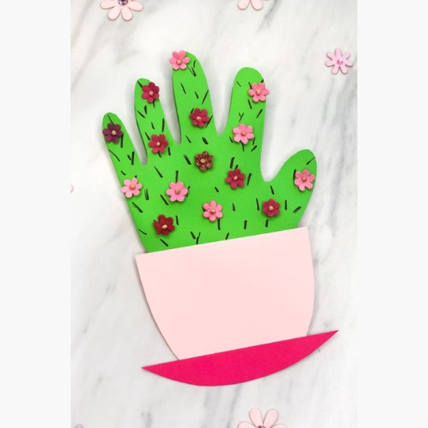 A cactus-themed Mother's Day card with handprint cutouts as the cactus and flowers