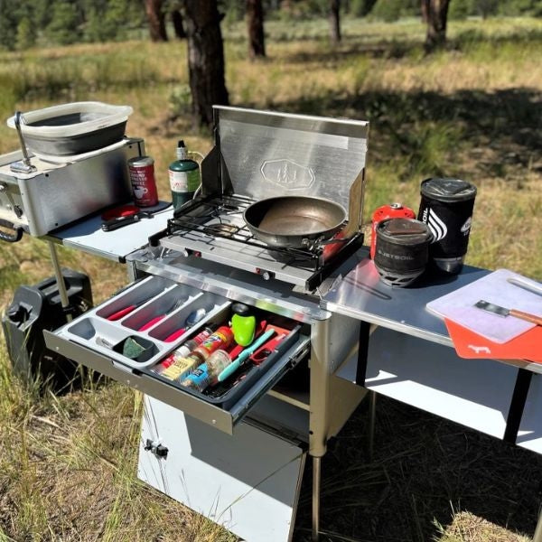 A convenient and compact camp kitchen setup for outdoor enthusiasts, perfect for gifting to dads who love camping