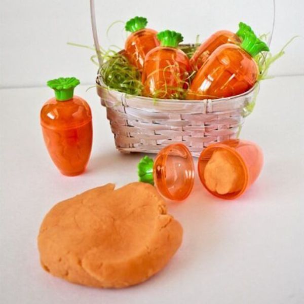 Foster creativity with DIY Carrot Orange Play-Dough as a vibrant and fun Easter craft for kids.