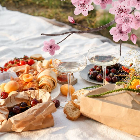 A serene cherry blossom picnic, perfect for a springtime celebration.