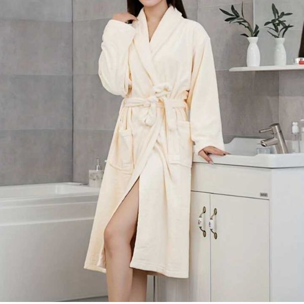 A plush, comfortable bathrobe hanging on a bathroom door hook - a luxurious bathrobe gifts for stay at home moms.