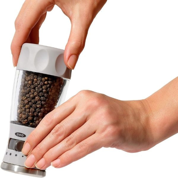 Contoured mess-free pepper grinder, practical New Year's Eve hostess gift.